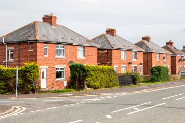 Row of redbrick detached houses on a UK street